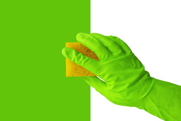 Hand, green rubber gloves, yellow sponge. Concept of sanitation and hygiene