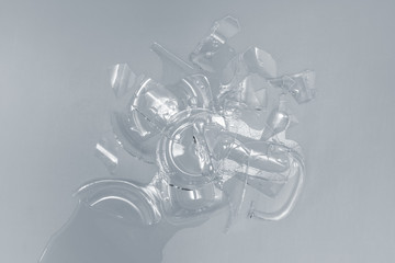Shards of glass cup with water, top view