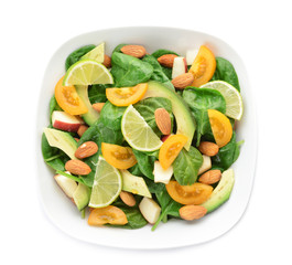 Bowl with tasty salad on white background