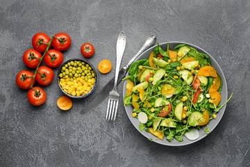 Bowl with tasty salad on dark background