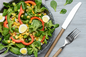 Bowl with tasty salad on table