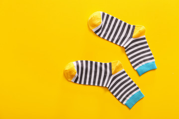 Cotton socks on color background