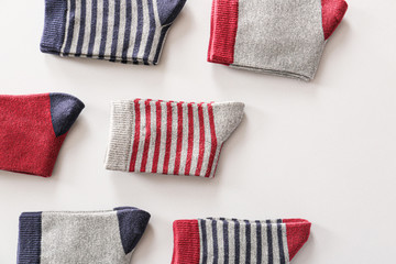 Different cotton socks on white background