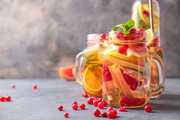 Mason jar of cold tea on dark background