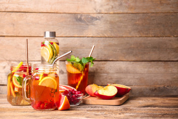 Tasty cold tea on wooden background