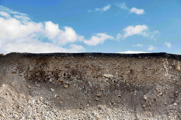 Cross section of asphalt road with blue sky background