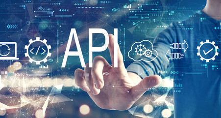 API - application programming interface concept with a man on blurred city background
