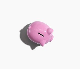 Pink piggy bank overhead view - flat lay