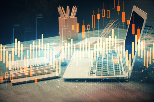 Financial chart drawing and table with computer on background. Multi exposure. Concept of international markets. © peshkova