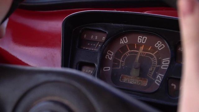 Close up view of speedometer red old retro car. Speed 60 kilometers per hour. Signs on russian: head lights, fuel