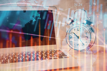 Financial chart drawing and table with computer on background. Double exposure. Concept of international markets.