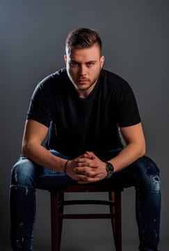 Young attractive man on cheir