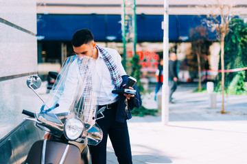 Modern businessman checking out his brand new italian bike.