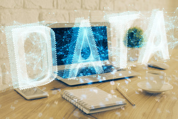 Double exposure of laptop computer and technology theme hologram. Concept of freelance work.