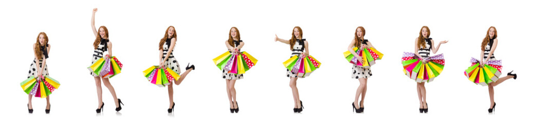 Young woman with shopping bags on white