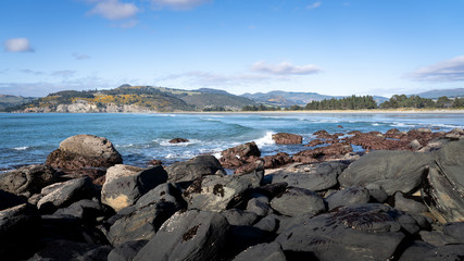 coastal landscape in New Zealand. Beach at high tide