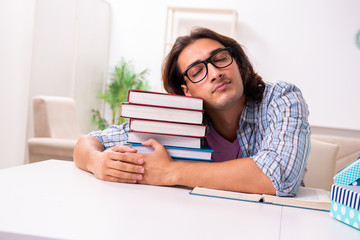 Young male student preparing for exams during Christmas