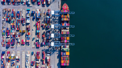 Aerial view container cargo ship freight shipping unloading at original destination port with quay crane, Business commercial global oversea logistic import export container box by container vessel . - obrazy, fototapety, plakaty