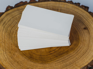 Business card mockup on wood table and white background. Business card template. Corporate stationery set mockup. Business card stack on isolated background. Top View. 