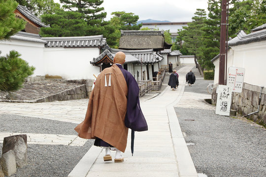 Buddhist priest walking in Myoshin-ji complex of temples in Kyoto