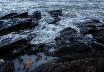 Waves coming to the rocky shore
