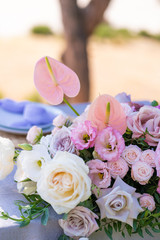 Bouquets of fresh flowers decoration of the festive table. Celebrating an open air party. Decor Details