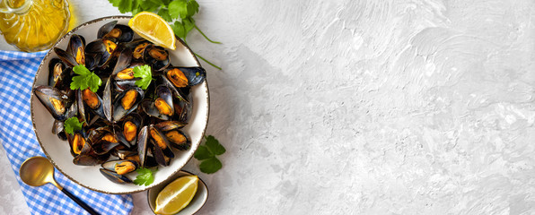 Delicious and healthy steamed mussels on white background