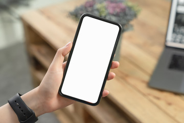 Hand holding blank screen of smartphone and for graphic display montage.