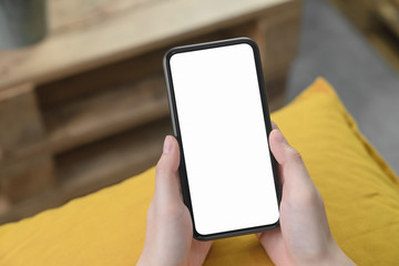 Hand holding blank screen of smartphone and for graphic display montage.