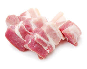 Raw pork belly pieces on a white background