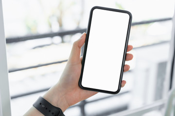 Hand holding blank screen of smartphone and for graphic display montage.
