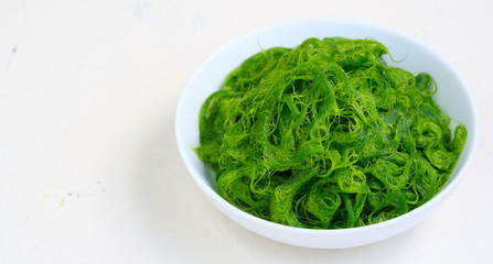 Fresh Algae in bowl on white backdrop.copy space .asia food.natural food