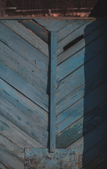 Wooden door with peeling paint and vintage handles with space for text