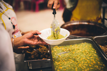 The concept of helping by providing food to the needy in the community.