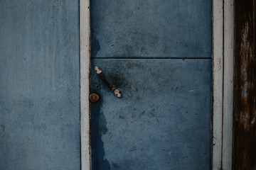 Metal door with vintage handles and rust with space for text