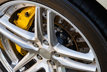 Plakat Automobile braking system. Ceramic carbon disk with perforation, ventilation and black calipers.