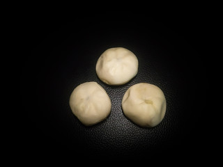  Chocolate bun isolated on black background