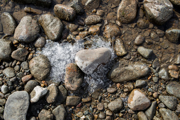 Pebble stone background. Sea Pebble. Beach stones. Natural background. Stone texture. Ice