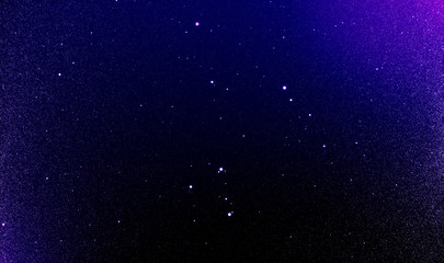 Fototapeta premium Abstract dust particles stars in the night sky background of flickering Ultra Violet tone and light flare