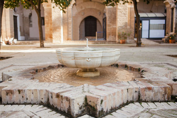 Fototapeta na wymiar Arab courtyard with fountain in Seville Spain