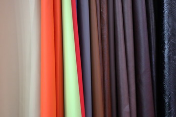 Multicolored leatherette is hanging in the store.
