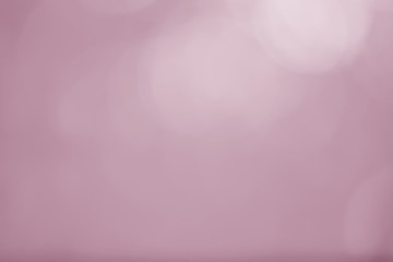 Abstract bokeh light sparkle on pink background