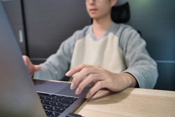 young man using a laptop