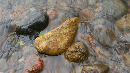 Rocks in the river after the flood. Images suitable for use as wallpaper or graphic material