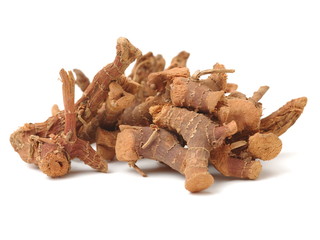 Dried galangal root isolated on white background