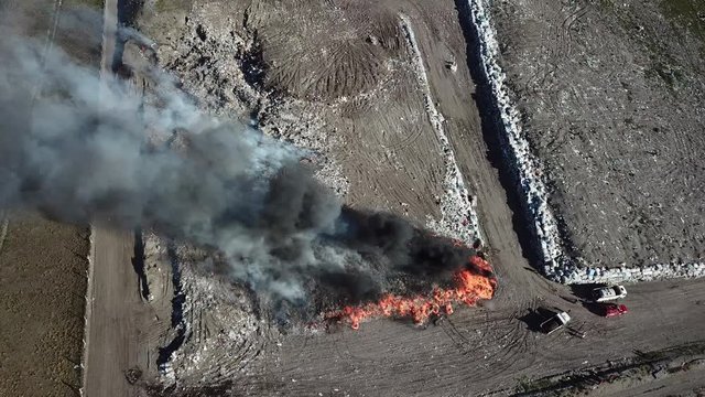 Aerial View Of Smoke And Fire From Burning Trash In Landfill. Intentional Pollution Of Air In Argentina