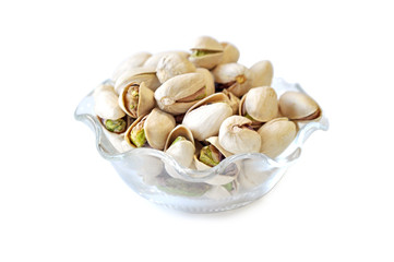 Pistachio in glass bowl  white background