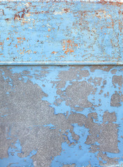 Fototapeta na wymiar blue paint cracks on old iron