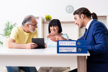 Financial advisor giving retirement advice to old couple