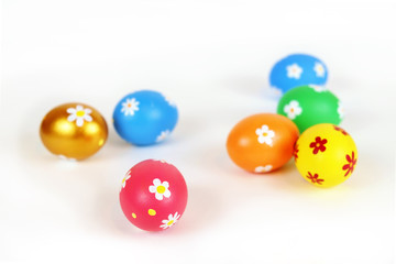 Colorful painted Easter eggs on the white surface